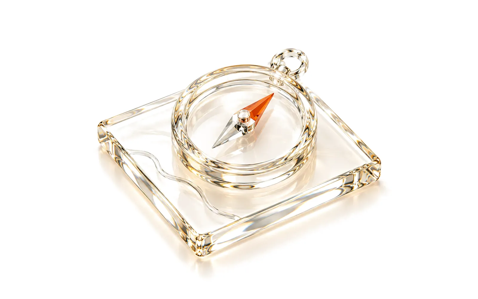 A glass compass lying on a glass tile with one faint lane line